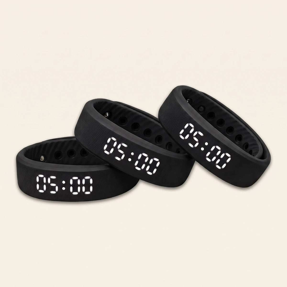 Household Pack: three Sovune Nudge wristbands with white displays reading 05:00