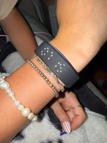 Sovune Nudge silent vibrating alarm wristband — on customer's wrist