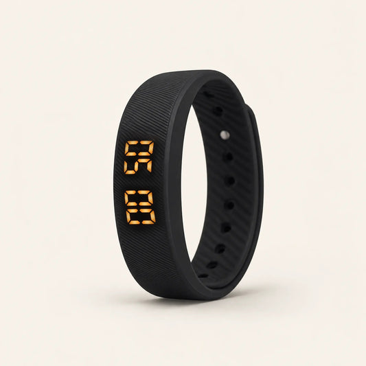 Sovune Nudge vibrating alarm wristband standing upright with its amber display showing the time