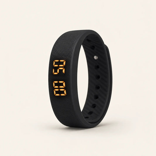 Sovune Nudge vibrating alarm wristband standing upright with its amber display showing the time