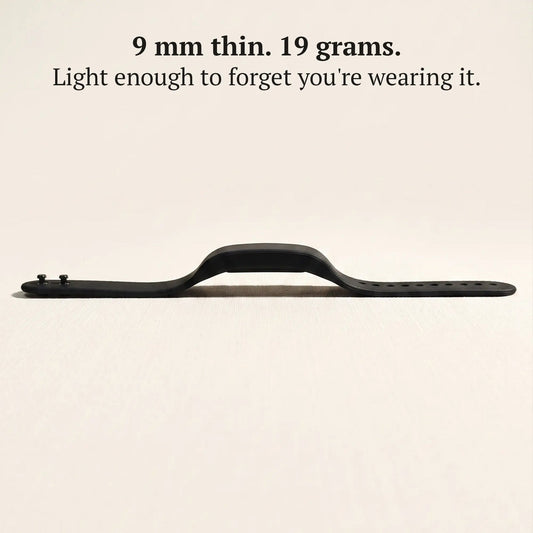 Side profile of the slim Sovune Nudge vibrating alarm wristband, lighter than a typical smartwatch