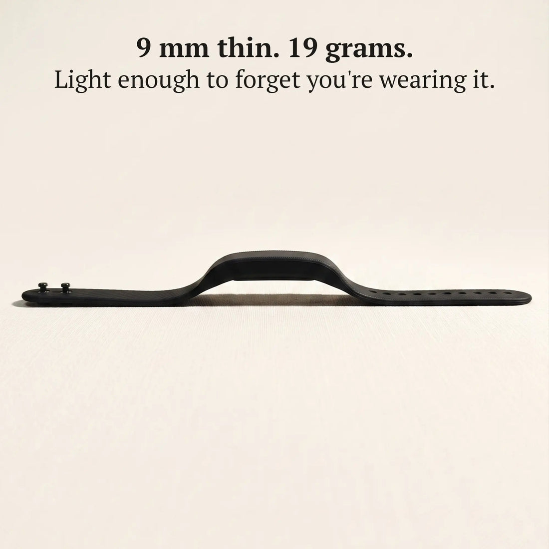 Side profile of the slim Sovune Nudge vibrating alarm wristband