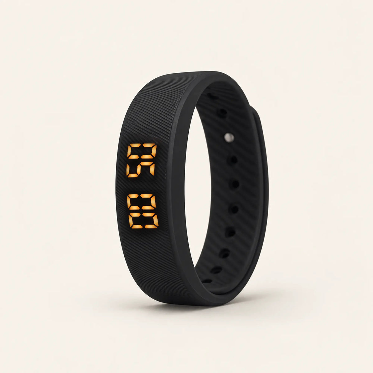 Sovune Nudge vibrating alarm wristband standing upright with its amber display lit