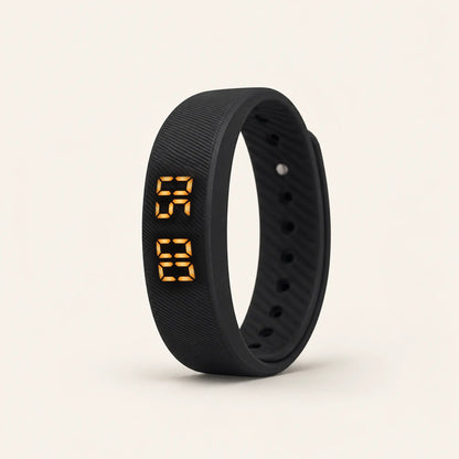 Sovune Nudge vibrating alarm wristband standing upright with its amber display lit