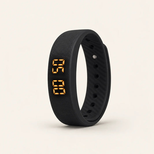 Sovune Nudge vibrating alarm wristband standing upright with its amber display lit