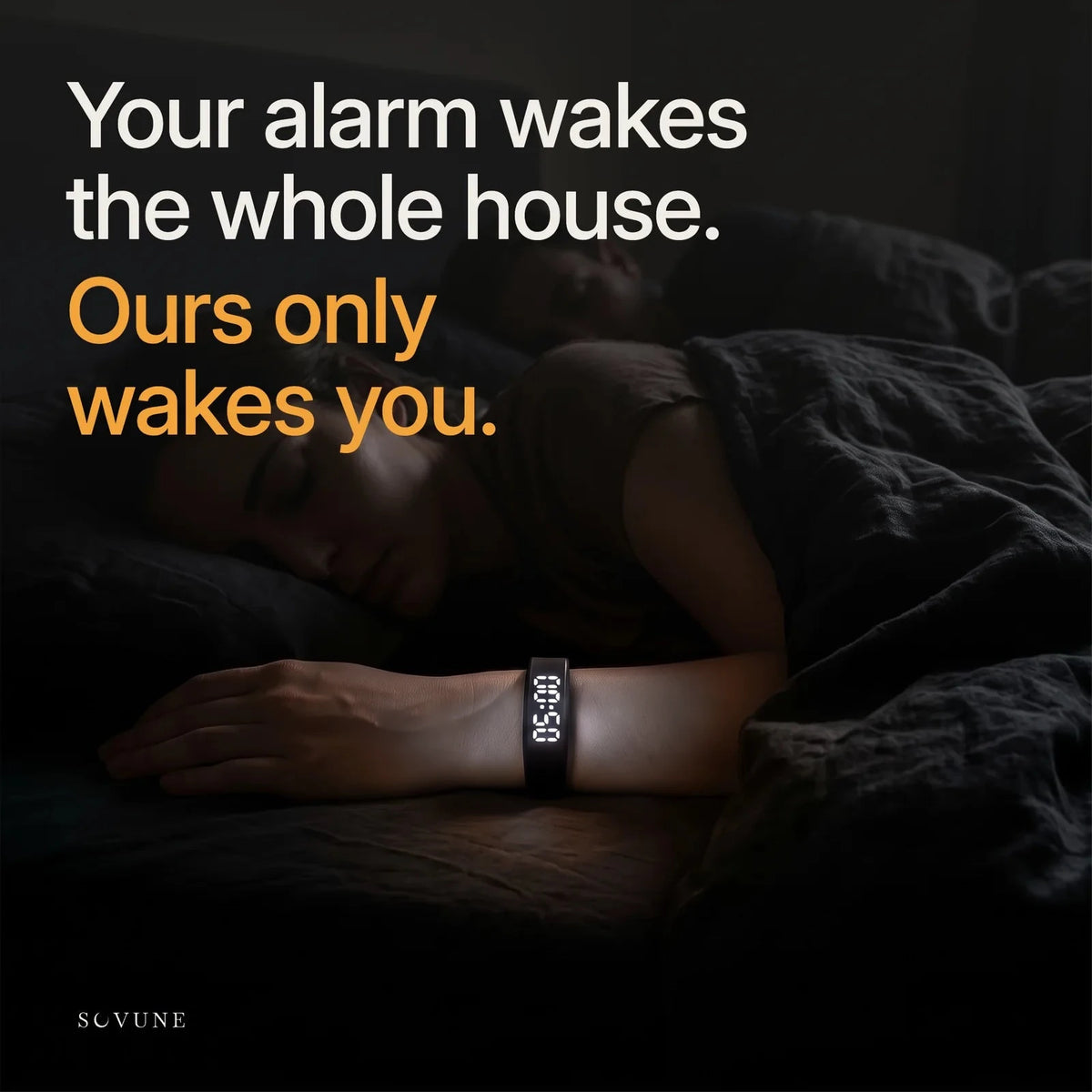 Person asleep at night wearing the Sovune Nudge. Your alarm wakes the whole house. Ours only wakes you.