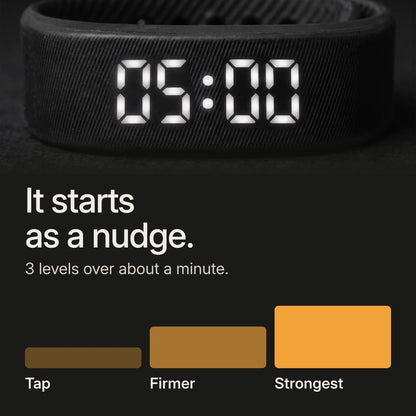 White display close-up. It starts as a nudge: three vibration levels rising over about a minute, from a gentle tap to hard to sleep through.