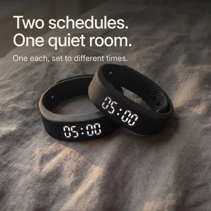 Two Sovune Nudge bands on a bed. The Partner Pack: one each, set to different times.