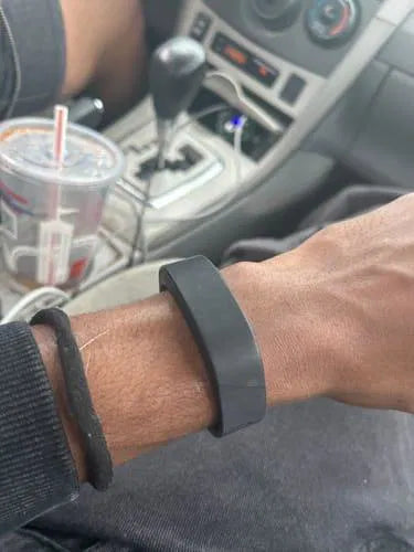 Sovune Nudge silent vibrating alarm wristband — on customer's wrist