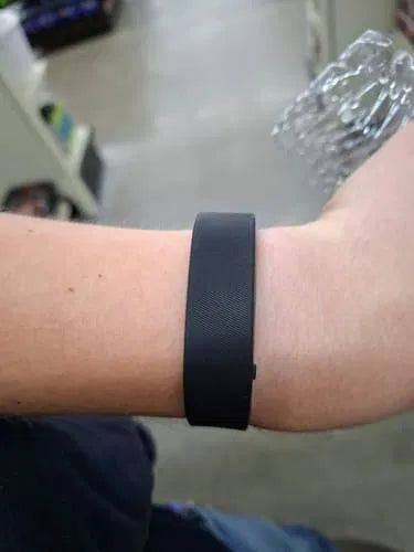 Sovune Nudge silent vibrating alarm wristband — on customer's wrist