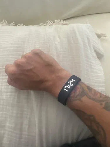 Sovune Nudge silent vibrating alarm wristband — on customer's wrist