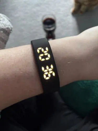 Sovune Nudge silent vibrating alarm wristband — on customer's wrist