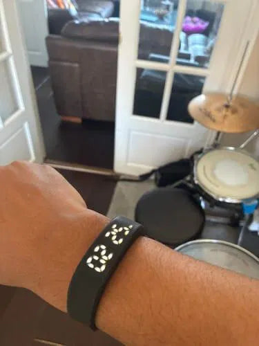 Sovune Nudge silent vibrating alarm wristband — on customer's wrist