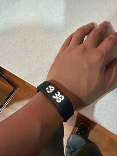 Sovune Nudge silent vibrating alarm wristband — on customer's wrist