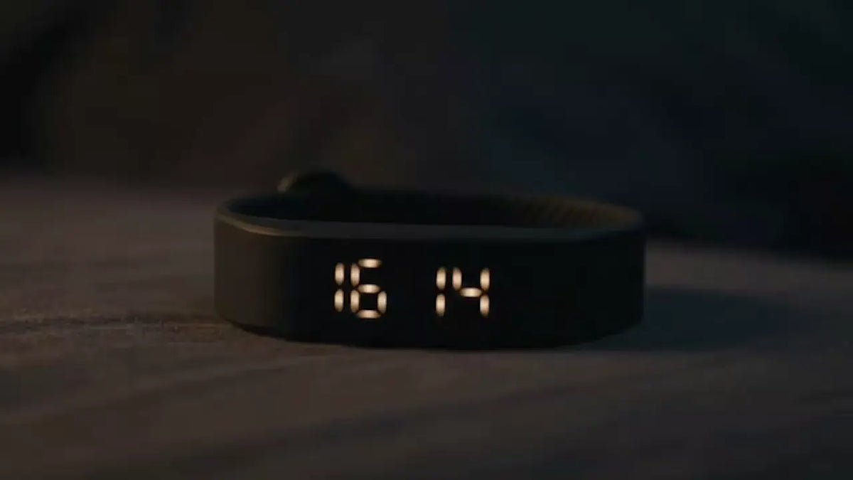 Close-up of the Sovune Nudge display glowing in a dark bedroom