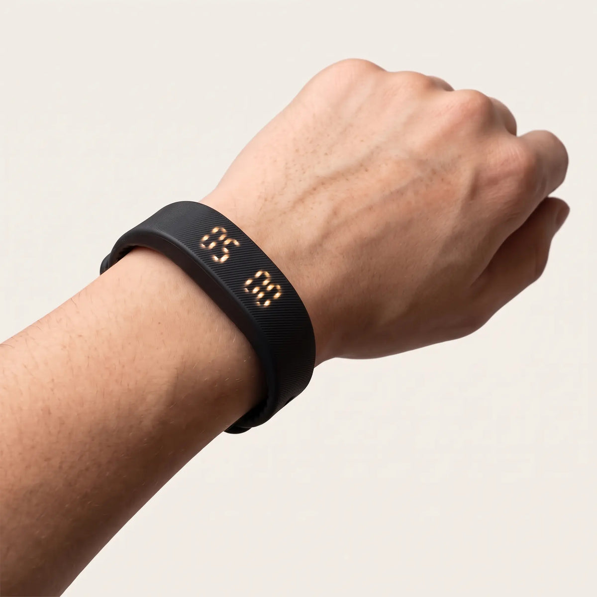 Band on the wrist with the display lit at wake-up time